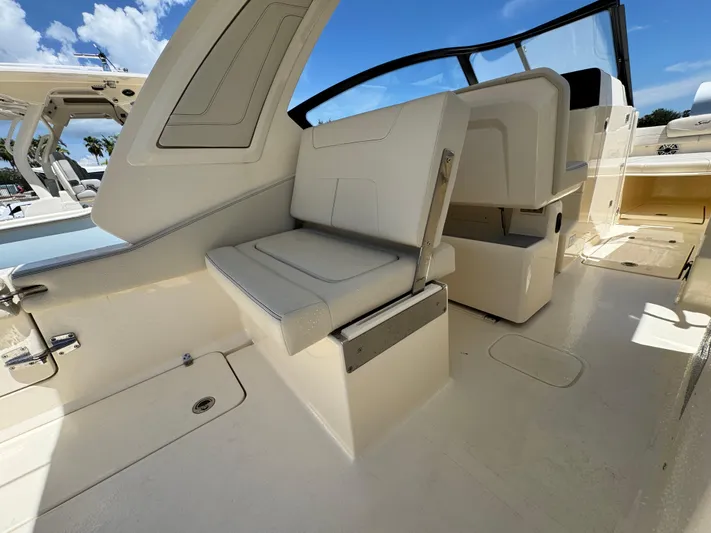  Yacht Photos Pics 2025 Scout 277 Dorado boat interior with sleek seating and modern design.