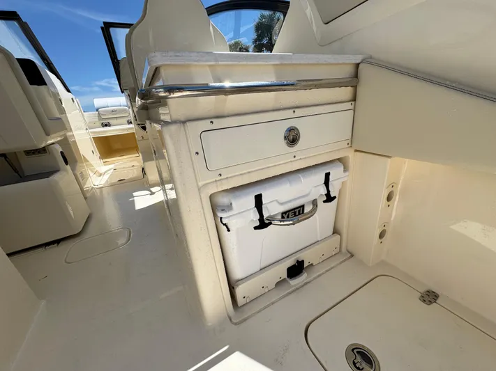  Yacht Photos Pics 2025 Scout 277 Dorado interior with Yeti cooler storage compartment.