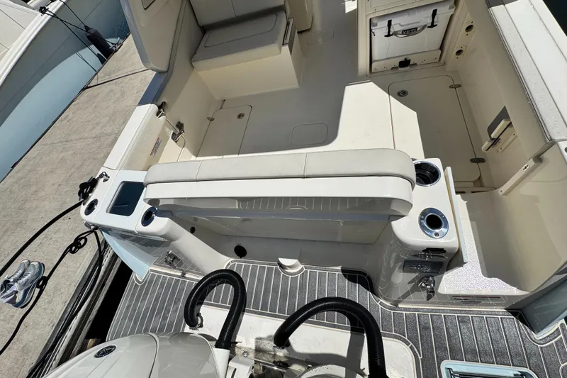  Yacht Photos Pics 2025 Scout 277 Dorado boat interior with seating and storage compartments.