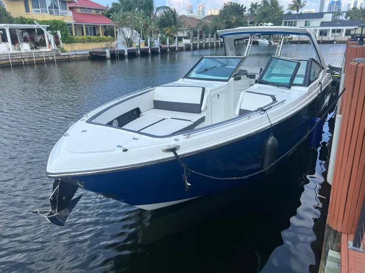  Yacht Photos Pics 2019 Monterey 378 Super Express boat docked in a scenic waterfront area.