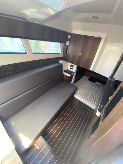  Yacht Photos Pics 2019 Monterey 378 Super Express cabin interior with modern furnishings and wood flooring.