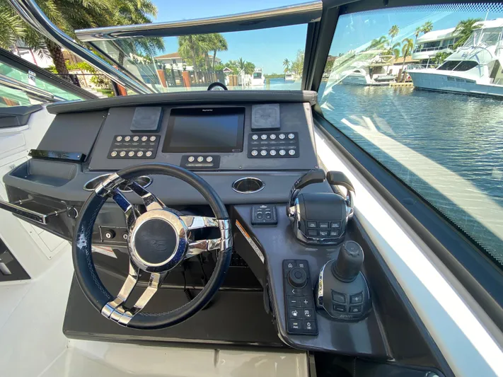  Yacht Photos Pics 2019 Monterey 378 Super Express boat helm with modern controls and waterfront view.