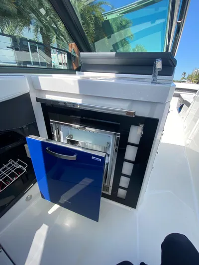  Yacht Photos Pics 2019 Monterey 378 Super Express boat interior with open blue cabinet.