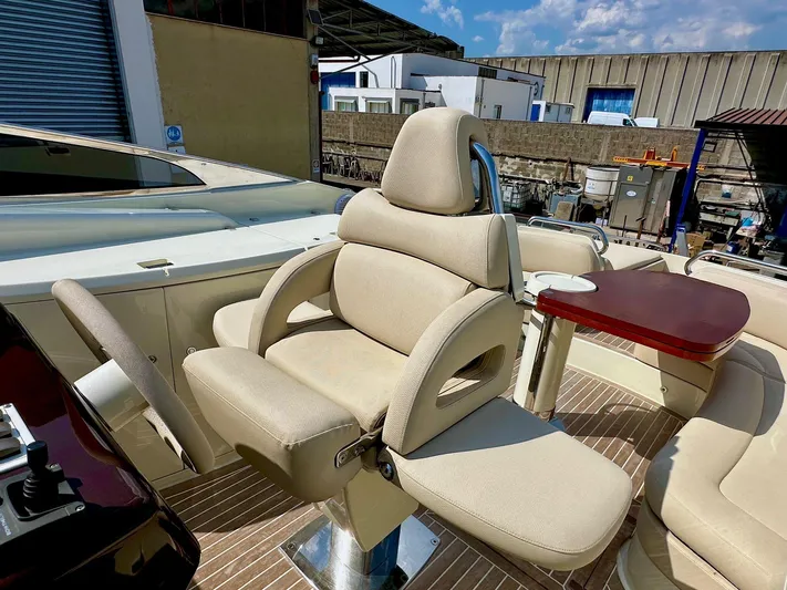  Yacht Photos Pics Luxurious seating on a 2003 Riva RivaRama 44 yacht, featuring beige upholstery and wooden accents.