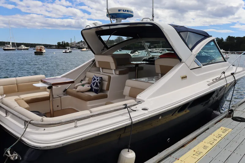 Cara Mia Yacht Photos Pics 2012 Tiara Yachts 3100 Coronet docked, featuring spacious seating and elegant design.