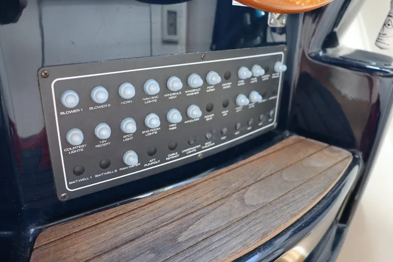 Cara Mia Yacht Photos Pics Control panel of a 2012 Tiara Yachts 3100 Coronet with labeled switches.