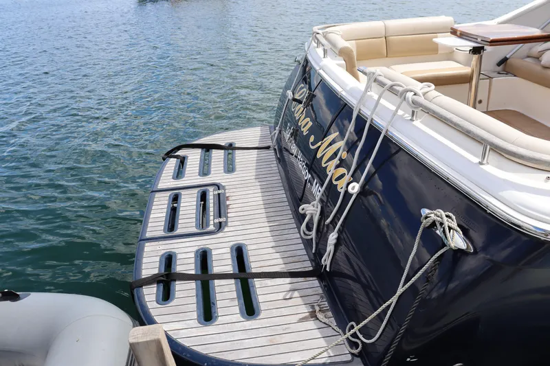 Cara Mia Yacht Photos Pics 2012 Tiara Yachts 3100 Coronet docked, featuring a spacious swim platform.