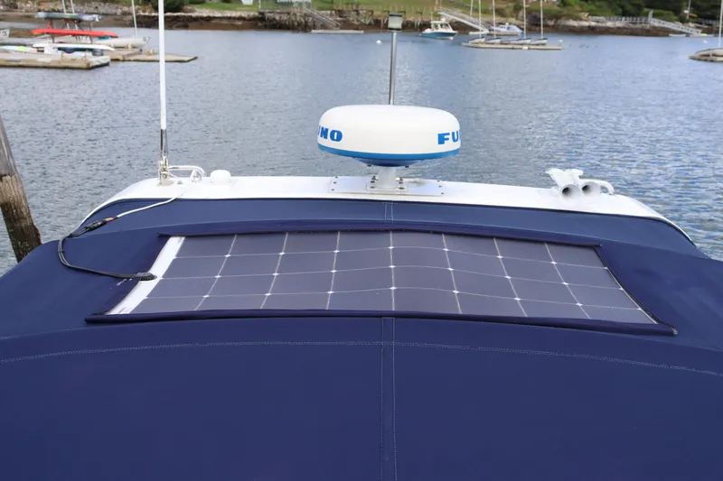 Cara Mia Yacht Photos Pics 2012 Tiara Yachts 3100 Coronet with solar panel on deck, docked in marina.