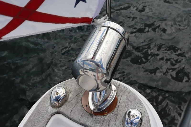 Cara Mia Yacht Photos Pics Tiara Yachts 3100 Coronet 2012, flagpole detail with chrome finish, on water background.