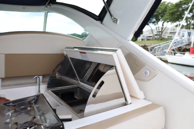 Cara Mia Yacht Photos Pics 2012 Tiara Yachts 3100 Coronet interior with open kitchenette and sink.