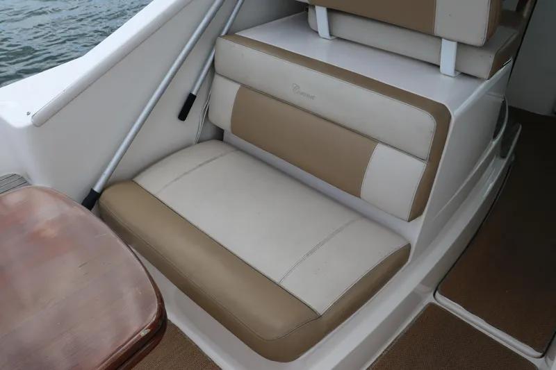 Cara Mia Yacht Photos Pics 2012 Tiara Yachts 3100 Coronet interior seating with beige and white upholstery.