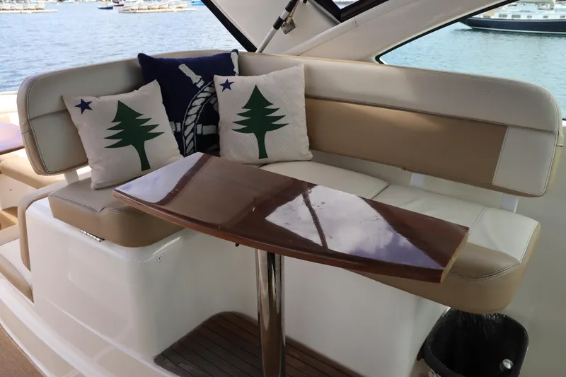 Cara Mia Yacht Photos Pics 2012 Tiara Yachts 3100 Coronet interior with cushioned seating and decorative pillows.