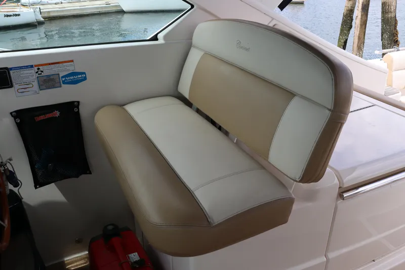 Cara Mia Yacht Photos Pics 2012 Tiara Yachts 3100 Coronet interior seating, beige and white upholstery, near water.