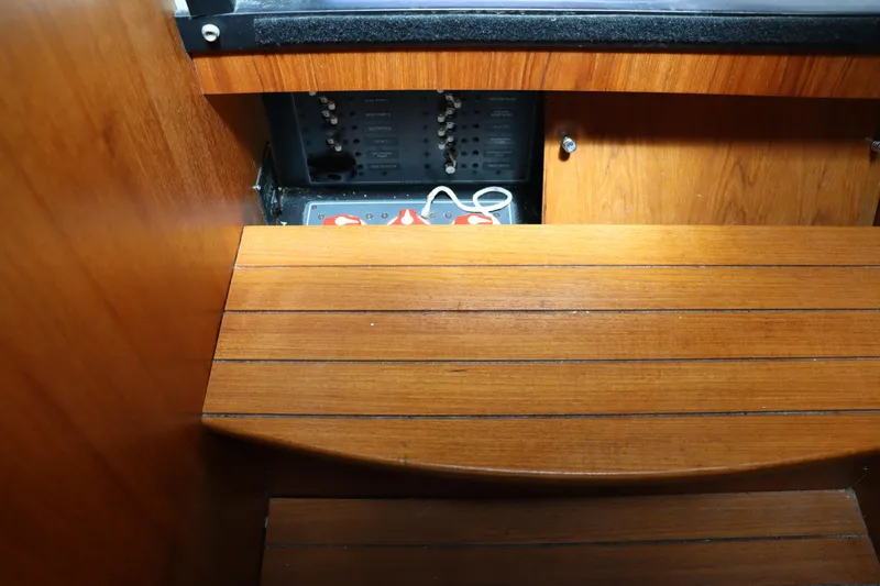 Cara Mia Yacht Photos Pics Interior view of 2012 Tiara Yachts 3100 Coronet showcasing wooden paneling and electrical components.