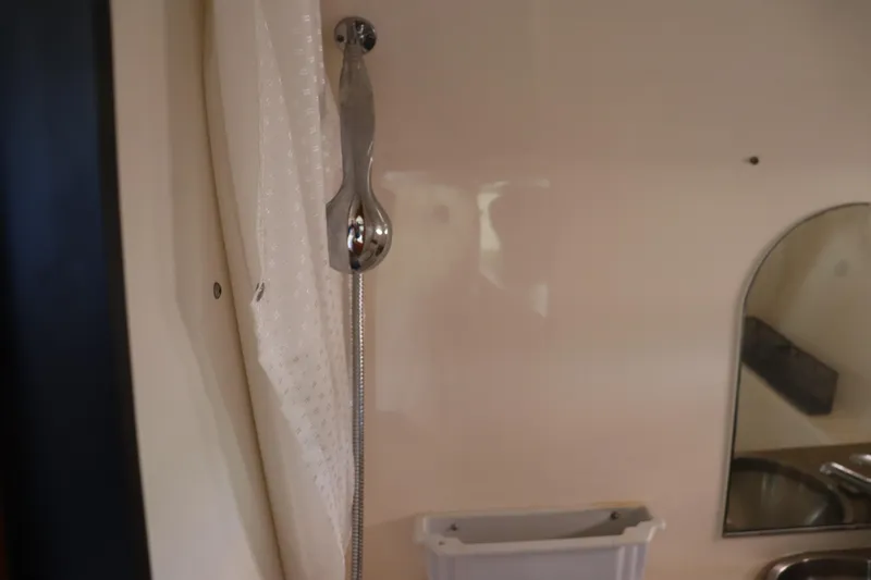 Cara Mia Yacht Photos Pics Shower area in 2012 Tiara Yachts 3100 Coronet, featuring chrome fixtures and mirror.