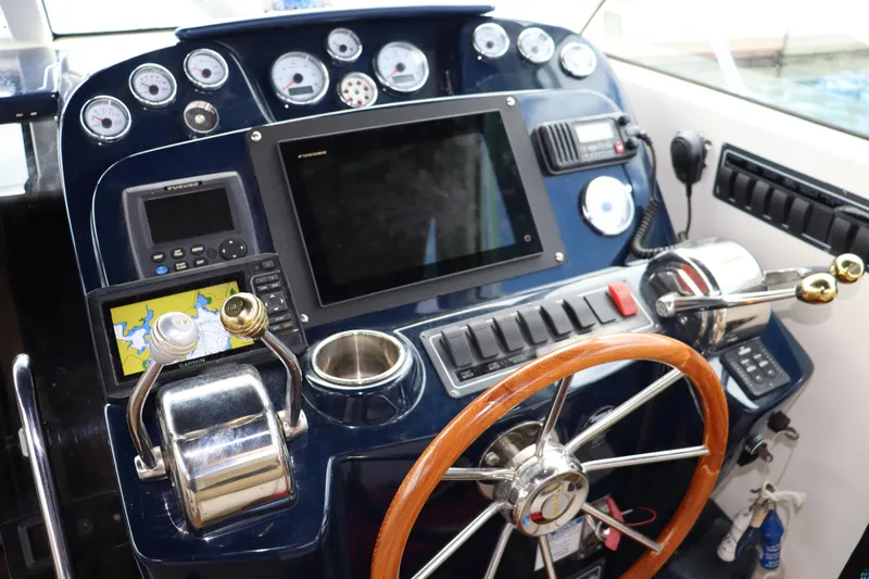 Cara Mia Yacht Photos Pics Cockpit of 2012 Tiara Yachts 3100 Coronet with navigation instruments and steering wheel.