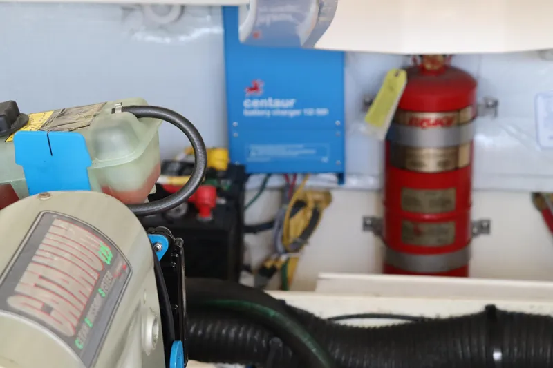 Cara Mia Yacht Photos Pics Engine compartment of 2012 Tiara Yachts 3100 Coronet with battery charger and fire extinguisher.