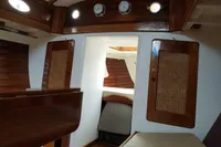 Interior of a 1935 Matthiesen & Paulsen SLOOP, featuring wooden cabinetry and classic nautical design.