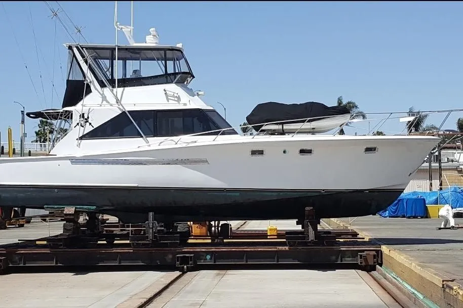 1974 Pacemaker 48 Sportfisherman yacht on dry dock, side view.