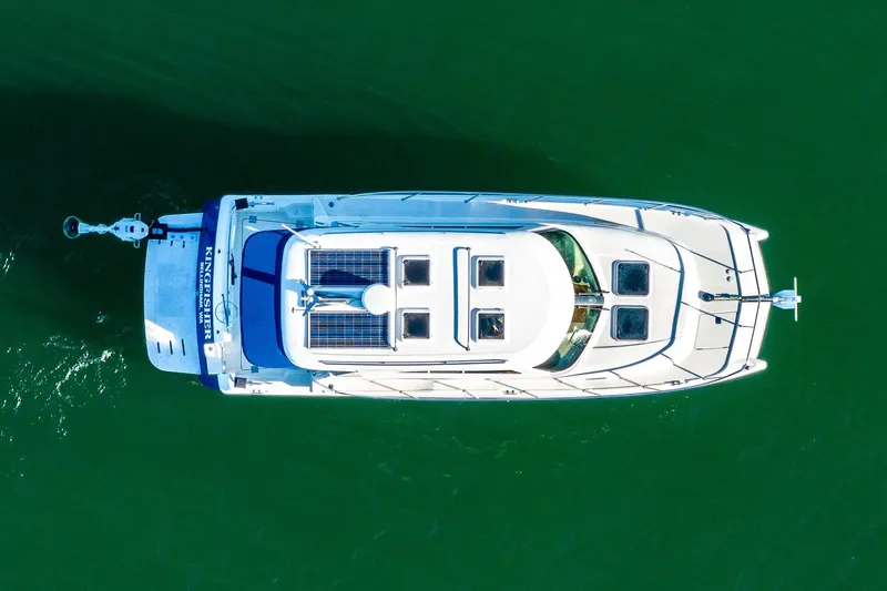  Yacht Photos Pics Aerial view of 2012 Aspen C90 boat on green water.