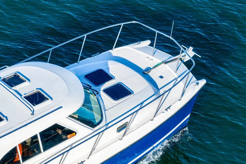  Yacht Photos Pics Aerial view of 2012 Aspen C90 boat cruising on blue water.