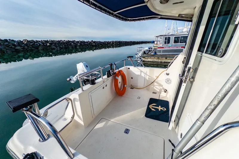  Yacht Photos Pics Aspen C90 boat deck, 2012 model, docked with calm water and safety equipment.