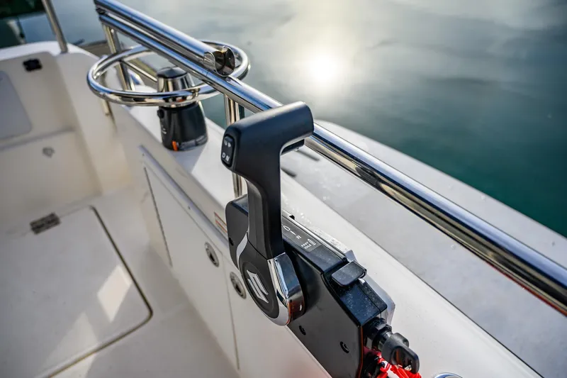  Yacht Photos Pics Control lever on 2012 Aspen C90 boat, with water reflection in the background.