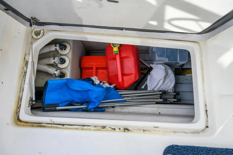  Yacht Photos Pics Storage compartment in 2012 Aspen C90 boat with equipment and supplies.