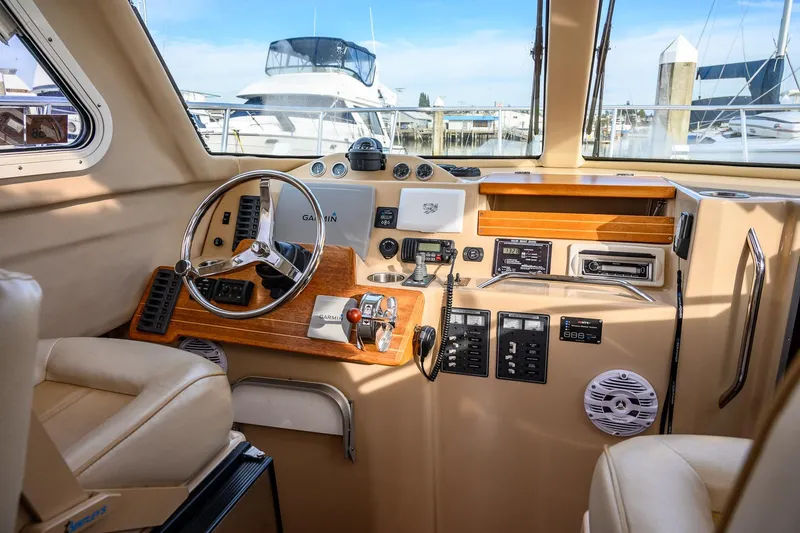  Yacht Photos Pics Interior of 2012 Aspen C90 boat cockpit with steering wheel and navigation controls.