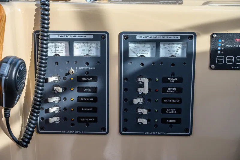  Yacht Photos Pics Electrical control panel on a 2012 Aspen C90 boat, featuring Blue Sea Systems components.