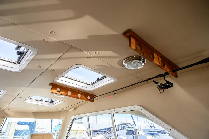  Yacht Photos Pics Interior view of 2012 Aspen C90 boat with skylights and fishing rod holder.