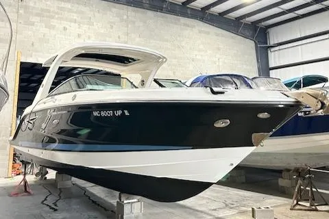  Yacht Photos Pics 2021 Sea Ray SLX 310 boat in storage, showcasing sleek design and modern features.