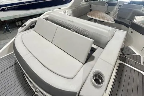  Yacht Photos Pics 2021 Sea Ray SLX 310 boat interior with luxurious seating and table.
