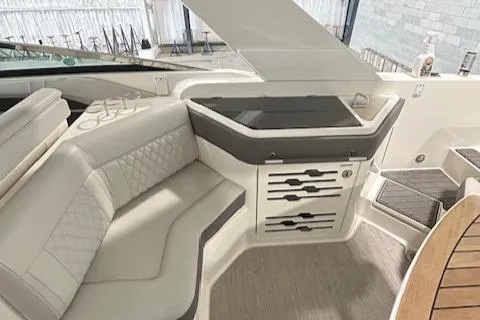  Yacht Photos Pics 2021 Sea Ray SLX 310 boat interior with elegant seating and storage area.