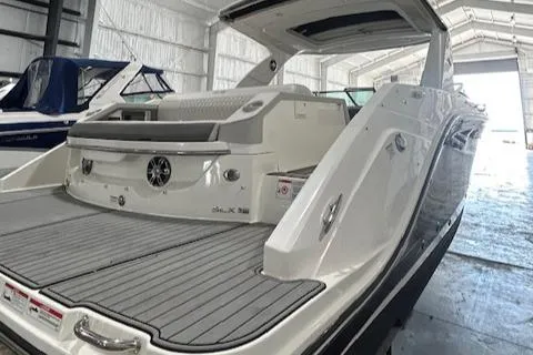  Yacht Photos Pics 2021 Sea Ray SLX 310 boat in a storage facility, rear view.