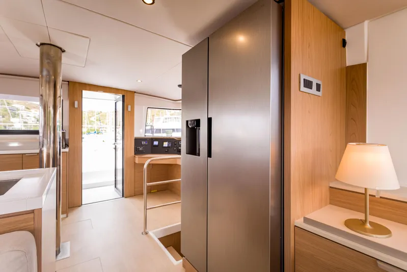 Tikka Yacht Photos Pics Modern interior of 2024 Bali 4.6 yacht with sleek kitchen and ambient lighting.