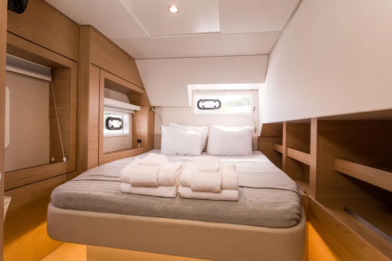 Tikka Yacht Photos Pics Luxurious cabin interior of 2024 Bali 4.6 yacht with cozy bed and modern design.