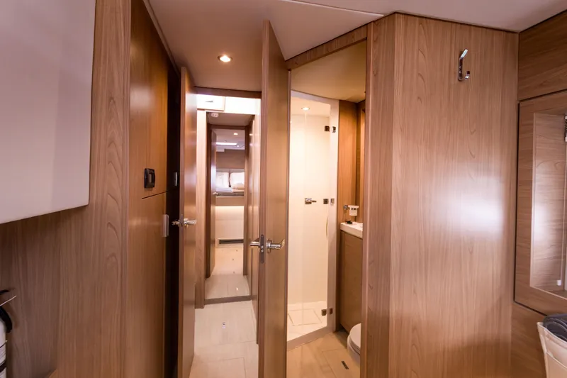 Tikka Yacht Photos Pics Luxurious interior of 2024 Bali 4.6 yacht featuring wood paneling and modern design.