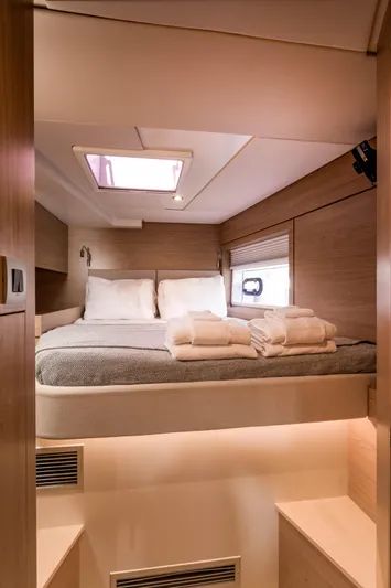 Tikka Yacht Photos Pics 2024 Bali 4.6 yacht interior bedroom with cozy bed and skylight.