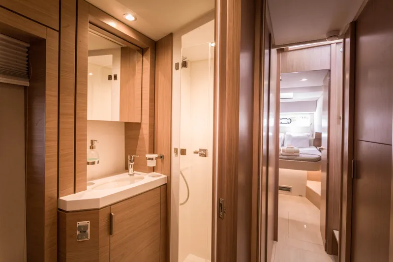 Tikka Yacht Photos Pics Luxurious interior of 2024 Bali 4.6 yacht featuring modern bathroom and cozy cabin.