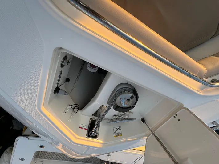  Yacht Photos Pics 2017 Boston Whaler 370 Outrage boat interior storage compartment with open hatch.