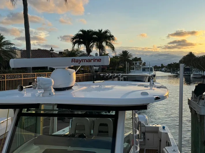  Yacht Photos Pics 2017 Boston Whaler 370 Outrage docked at sunset with Raymarine equipment.
