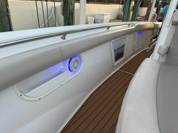  Yacht Photos Pics 2017 Boston Whaler 370 Outrage boat interior with blue LED lights and teak flooring.