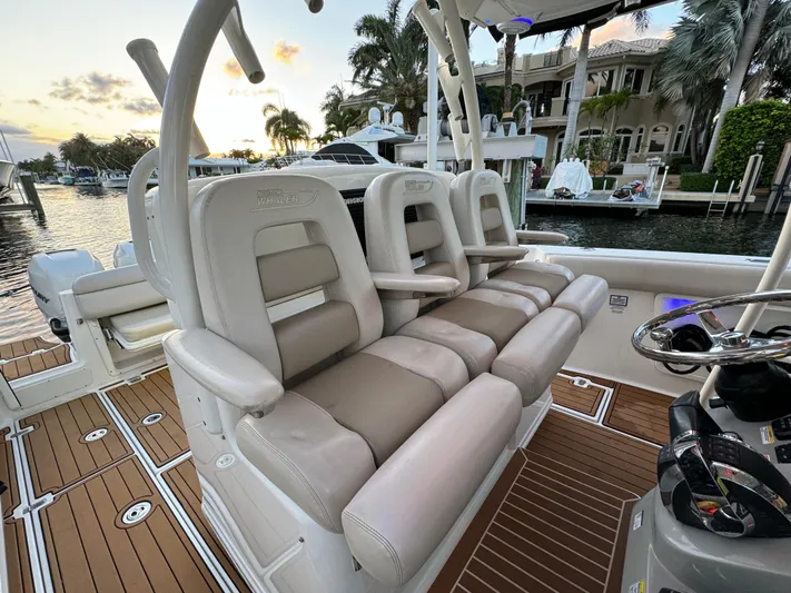  Yacht Photos Pics 2017 Boston Whaler 370 Outrage boat interior with luxurious seating and waterfront view.
