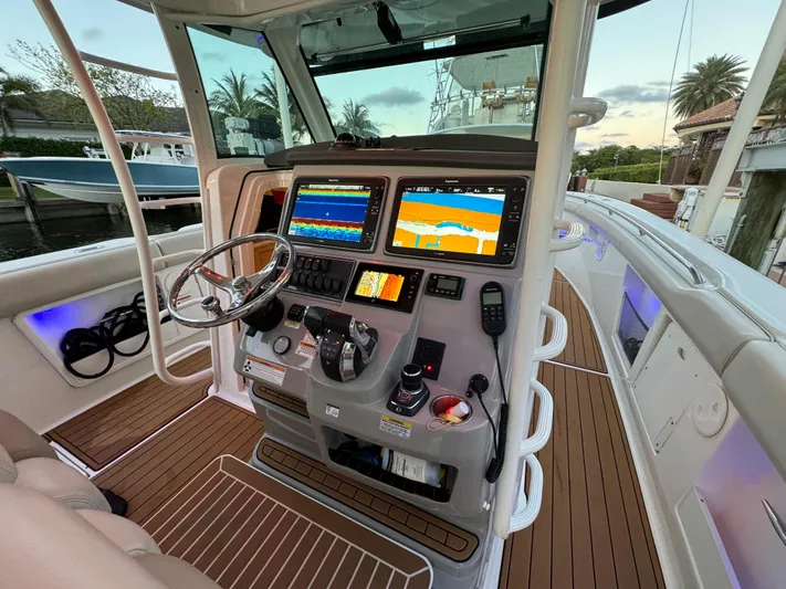  Yacht Photos Pics 2017 Boston Whaler 370 Outrage helm with advanced navigation displays and controls.