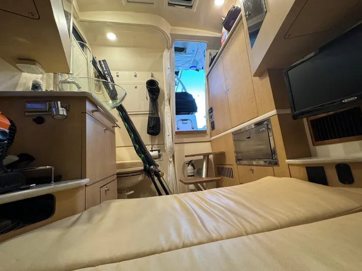  Yacht Photos Pics Interior cabin of 2017 Boston Whaler 370 Outrage, featuring cozy seating and modern amenities.