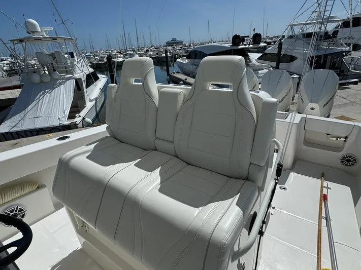  Yacht Photos Pics 2024 SeaVee 340Z boat with white leather seats at marina.