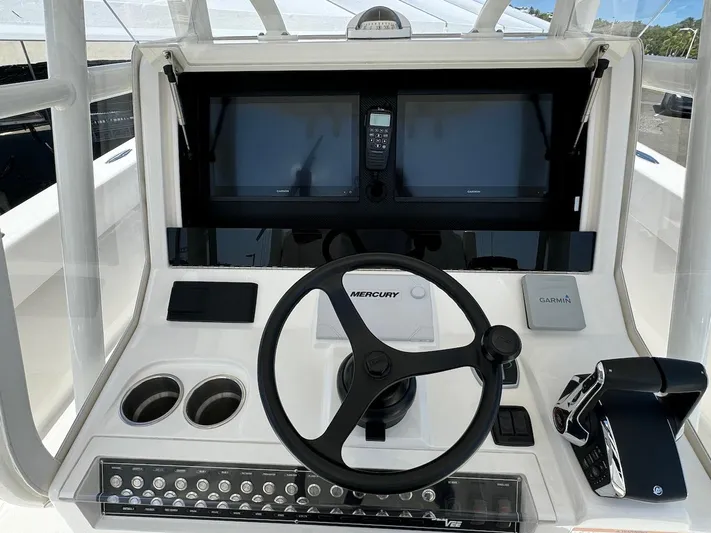  Yacht Photos Pics 2024 SeaVee 340Z boat dashboard with steering wheel and navigation screens.