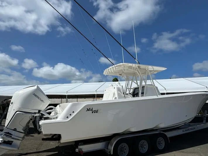  Yacht Photos Pics 2024 SeaVee 340Z boat on trailer under blue sky.