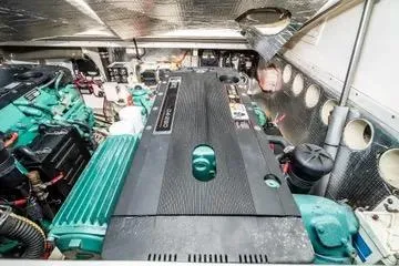 Jesses Girl Yacht Photos Pics Engine room of a 2005 Carolina Classic 28 boat, showcasing dual engines.